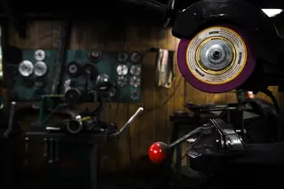 Grinding wheel and metalworking equipment in a workshop