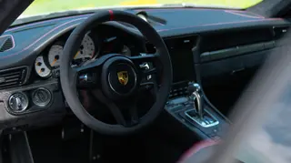Sports-car steering wheel and dashboard