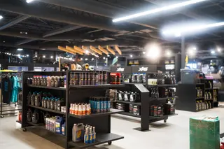Retail shelves filled with colourful drinks and products