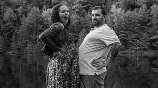 Playful lakeside couple portrait in black and white
