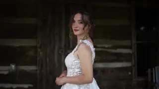 Close portrait of a bride against weathered timber