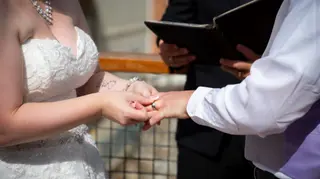 Close view of the couple’s hands during their wedding ceremony